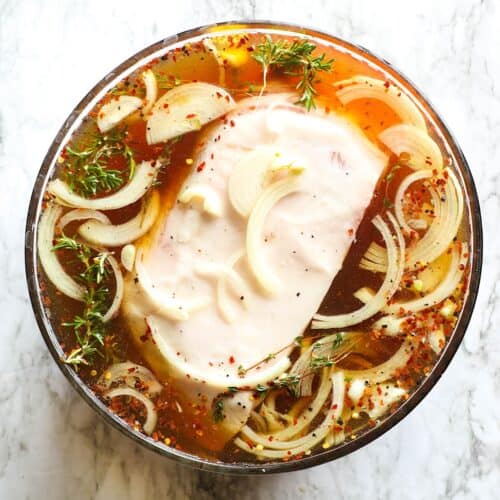 A pork butt brine delivers a juicy, fall-off-the-bone tender roast.