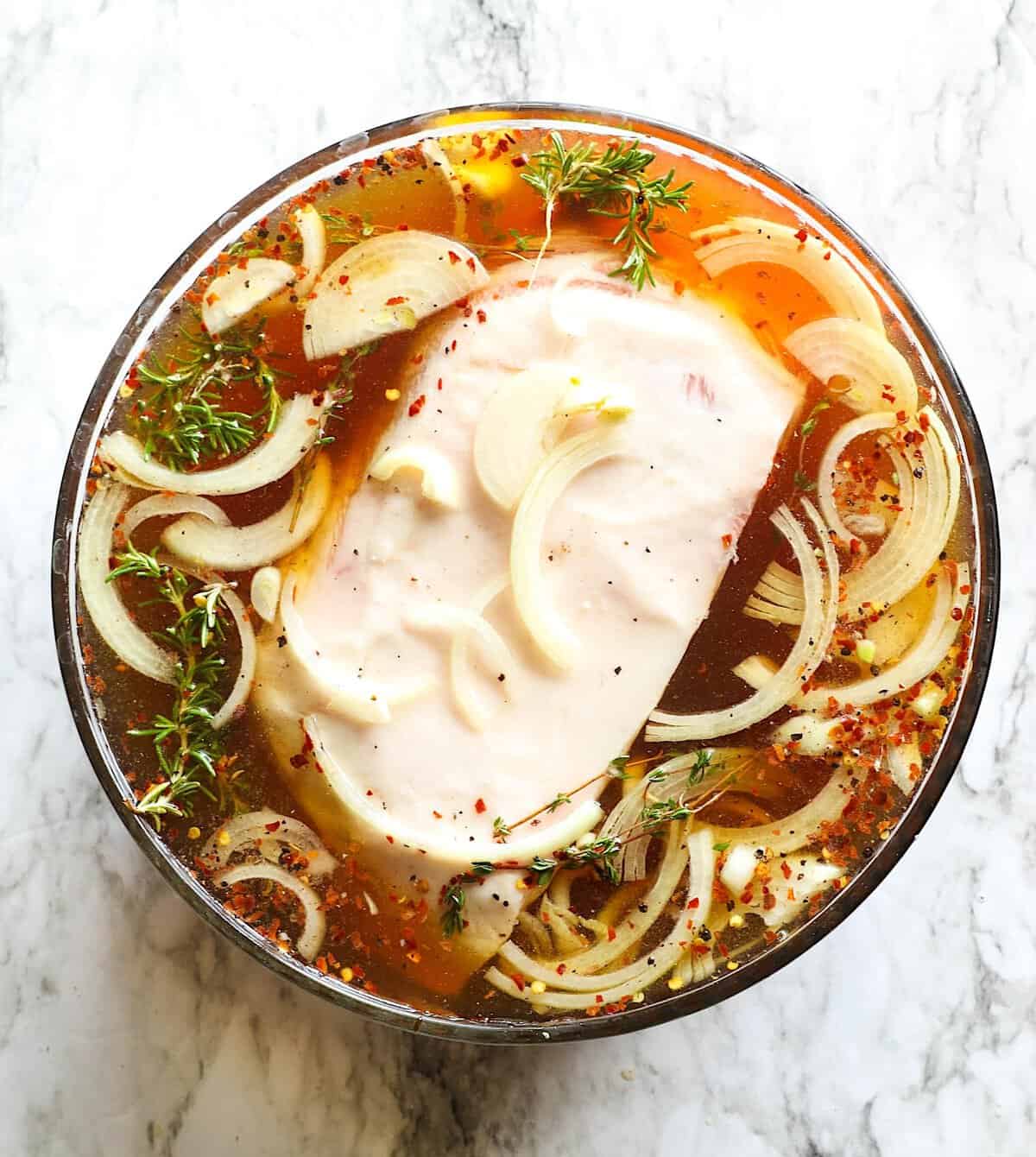A pork butt brine delivers a juicy, fall-off-the-bone tender roast.