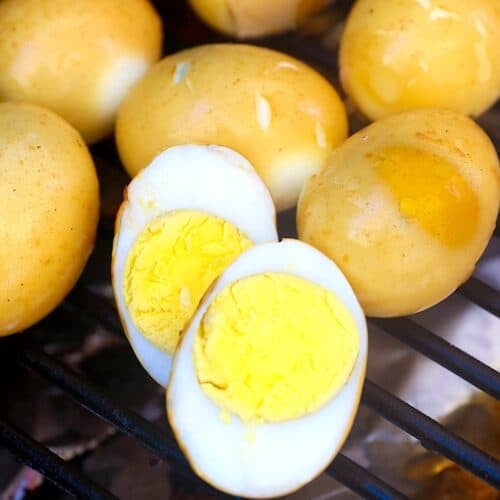 Slicing into an egg still in the smoker.