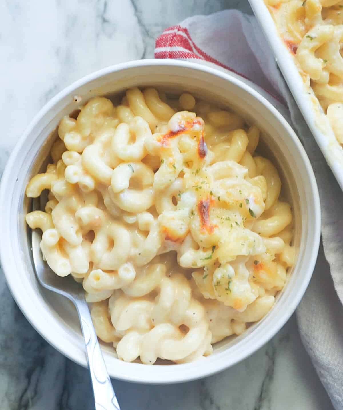 Diving into a bowl of steaming hot smoked Gouda mac and cheese.