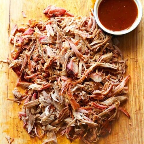 Shredded pork butt fresh from the smoker for a family cookout.
