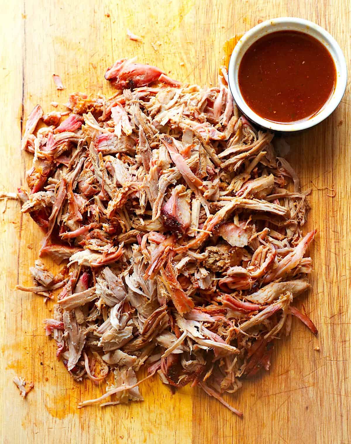 Shredded pork butt fresh from the smoker for a family cookout.