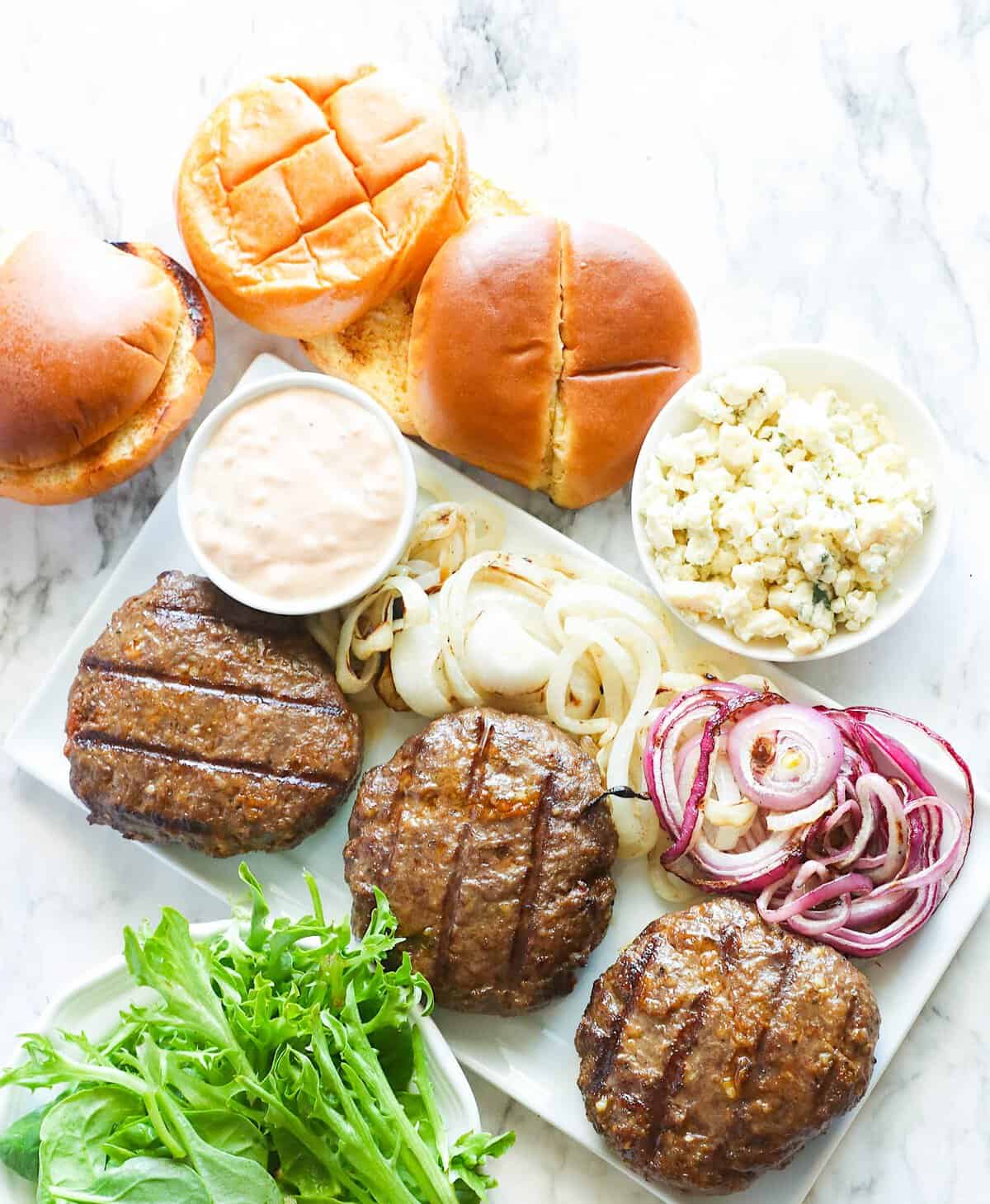 A deliciously grilled burger made with Wagyu ground beef and ready to assemble.