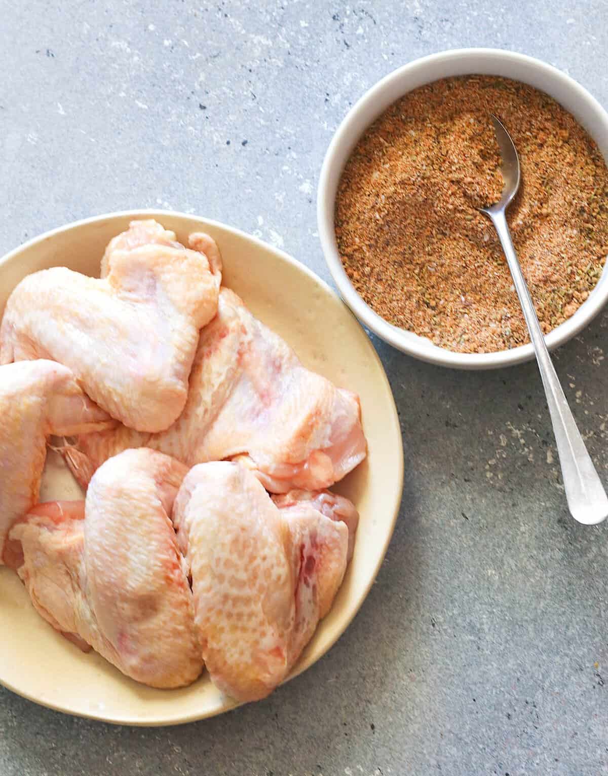 Getting ready to use a dry rub for grilling crispy chicken wings.