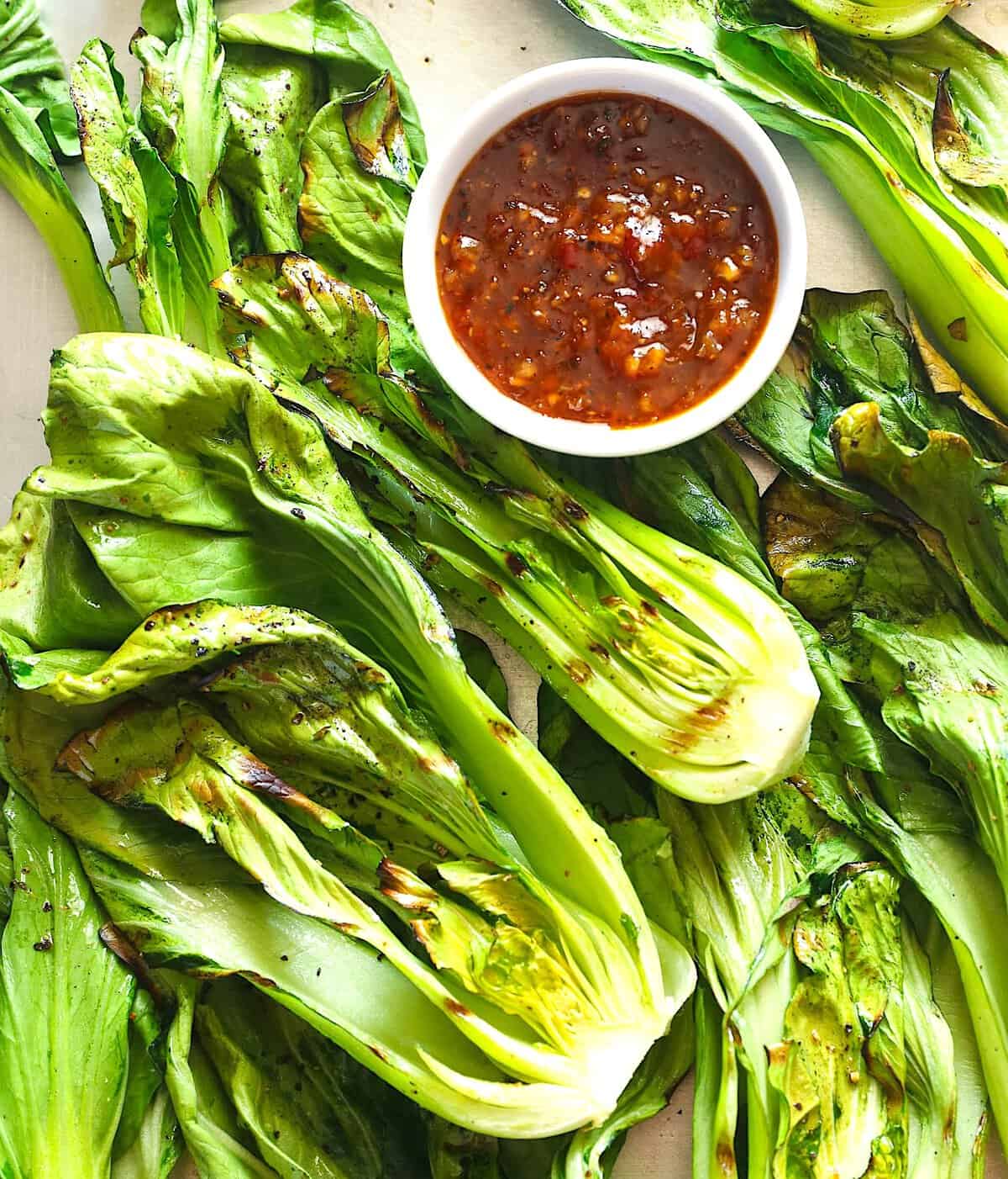 Getting ready to enjoy grilled bok choy with an Asian-inspired sauce.