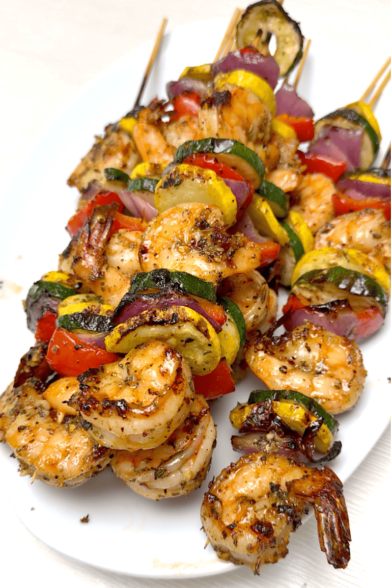 Serving up a platter of freshly grilled shrimp and veggies.