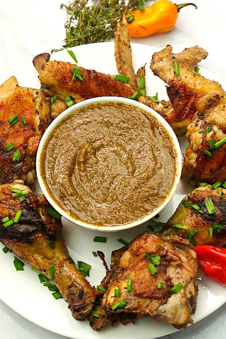 Serving up a spicy, savory Jamaican jerk sauce with grilled chicken wings.