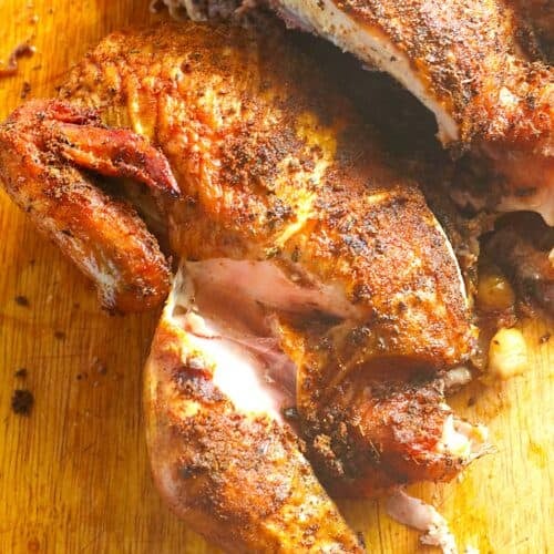 Showing off the juicy chicken on a cutting board. The smoker is the way to go for whole chickens.