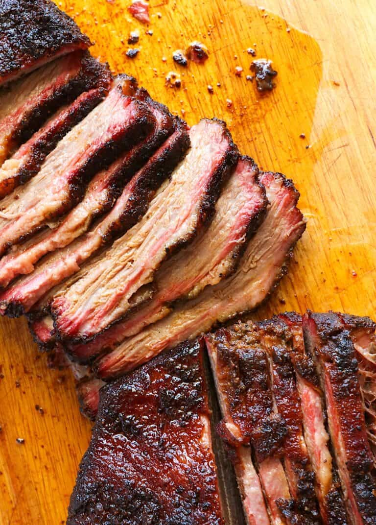 Slicing into juicy, fork-tender smoked beef brisket.