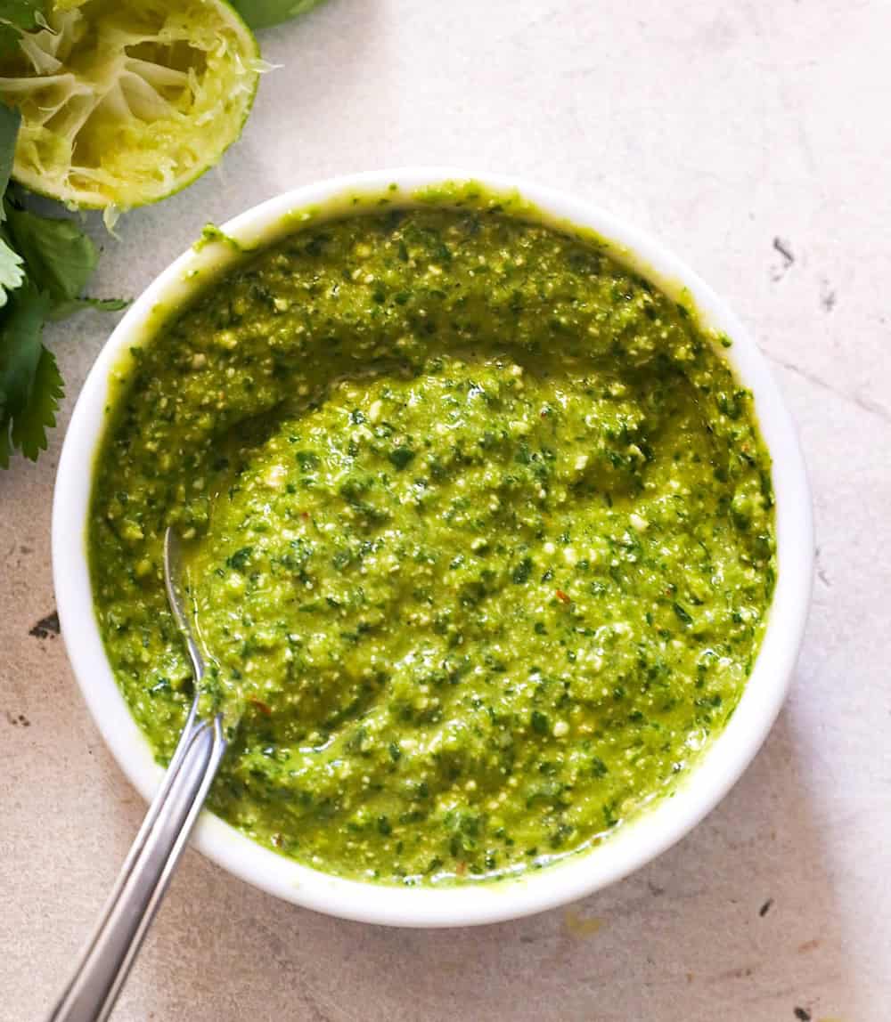 Spooning up some spicy Peruvian-style green sauce that's popular in the States.