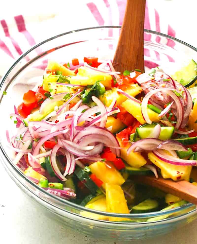Mixing the salad with the dressing, and ready to enjoy.