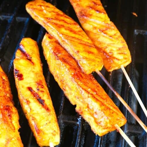 Pineapple wedges in the smoker for a tender, juicy appetizer, dessert or side dish.