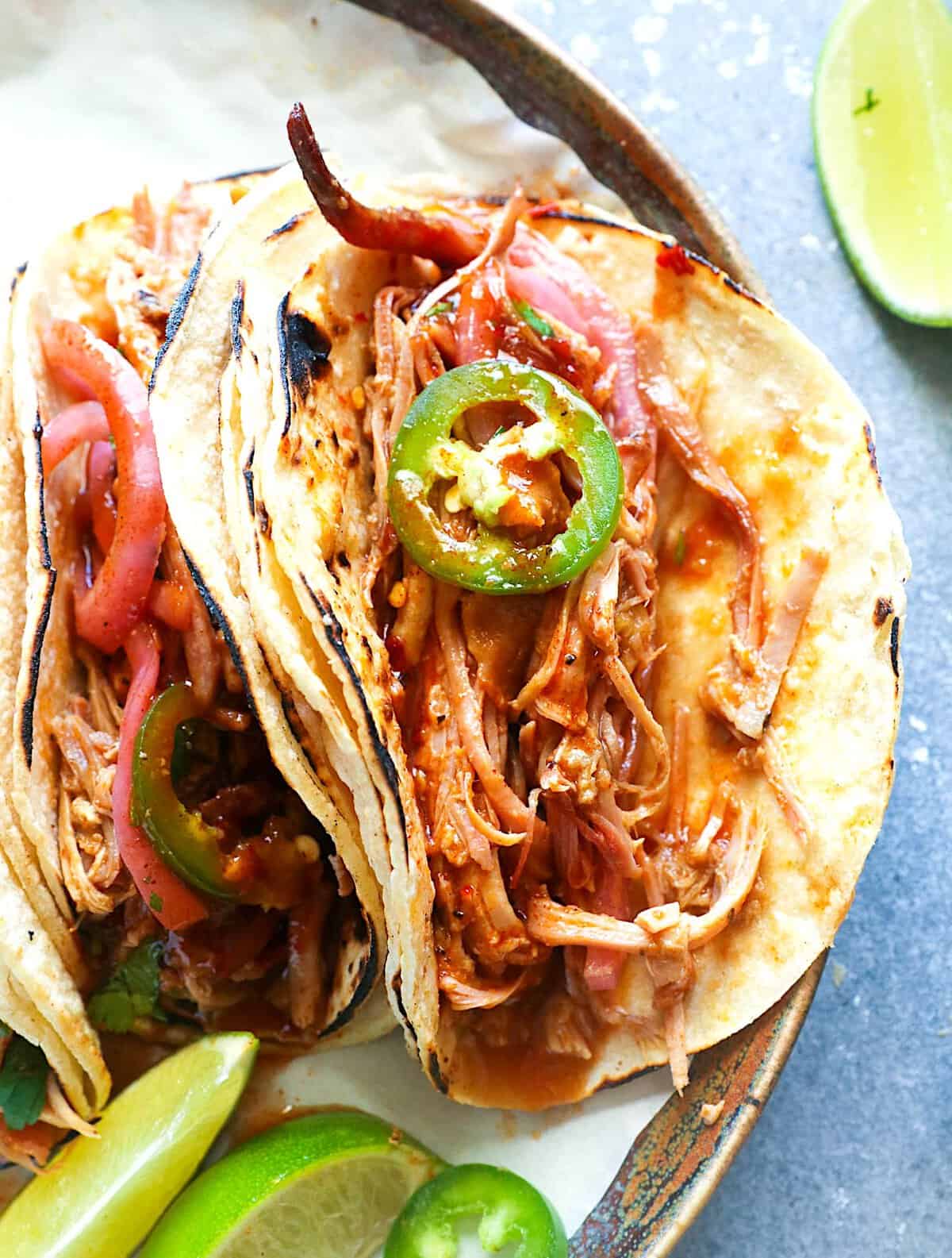 An amazing taco filled with Southern pulled pork and topped with pickled jalapenos.