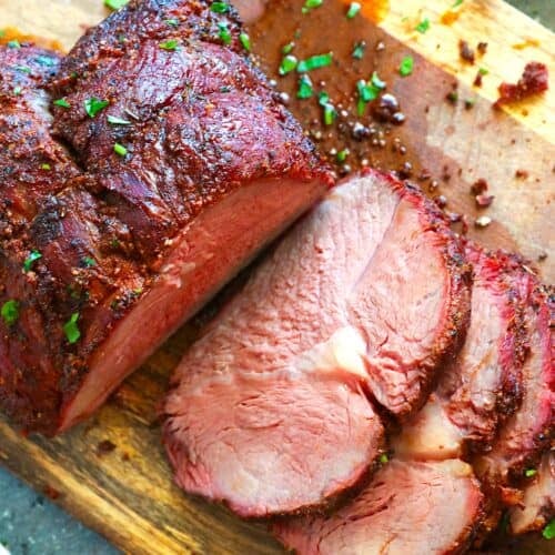Slicing into a rested and smoked sirloin tip roast for an easy dinner.
