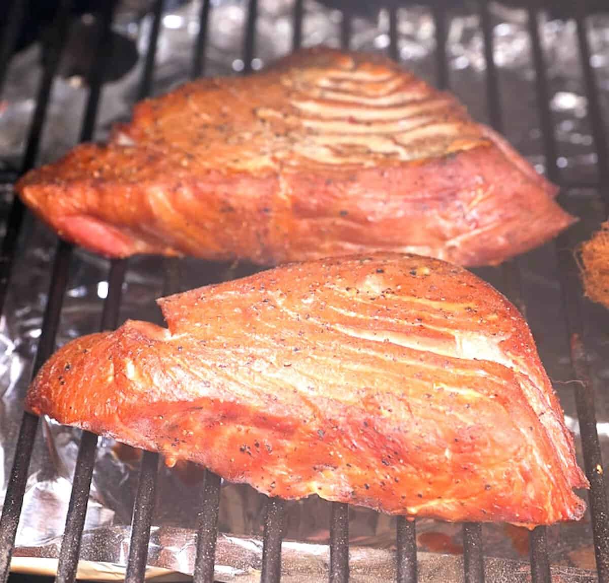 Fresh tuna steaks in the smoker for a flaky moist entree.