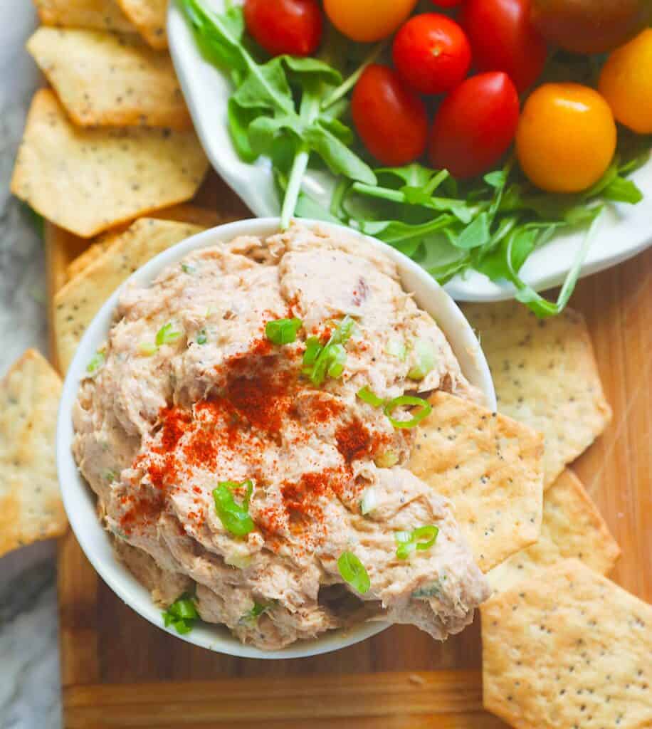 Diving into freshly made and chilled smoked tuna dip with crackers.