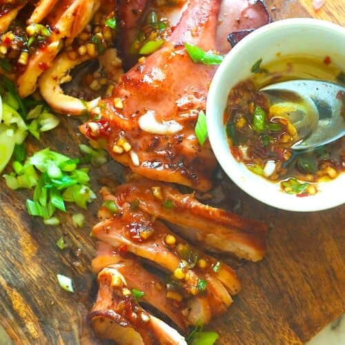 Slicing into tender grilled squid for an amazing calamari twist.