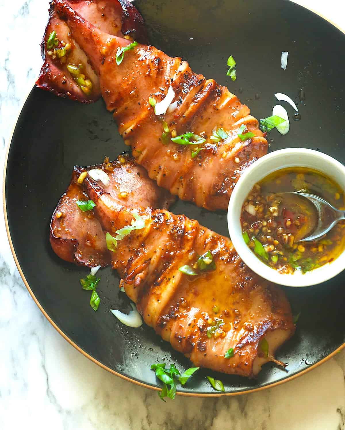 Savory, marinated, and glazed squid fresh off the grill.