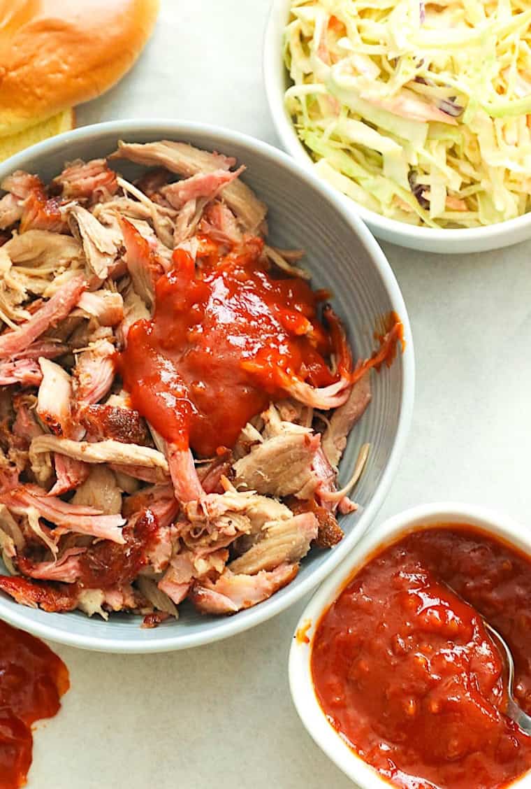Add BBQ sauce to shredded pork made easy in the pellet grill.