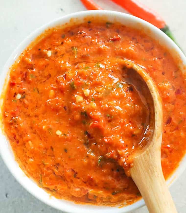 Serving up freshly made peri peri sauce, perfect for grilling chicken.
