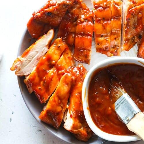 Sliced chicken thighs slathered with BBQ sauce for a delicious entree.