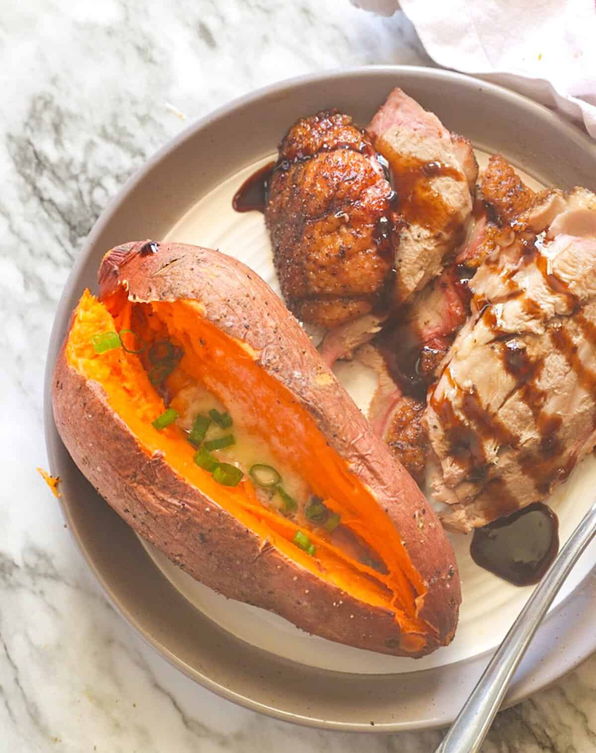 Serving up sweet potatoes fresh from the smoker with pellet grilled pork.