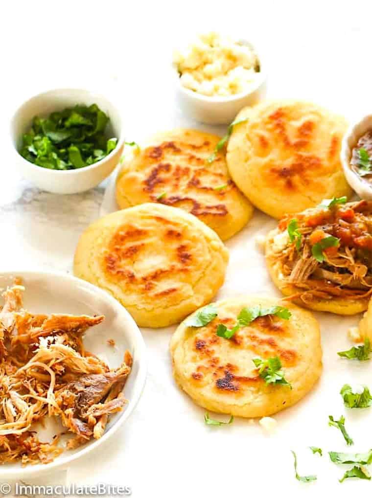 Making arepas Colombian style, thinner and topped with meat for a satisfying treat.