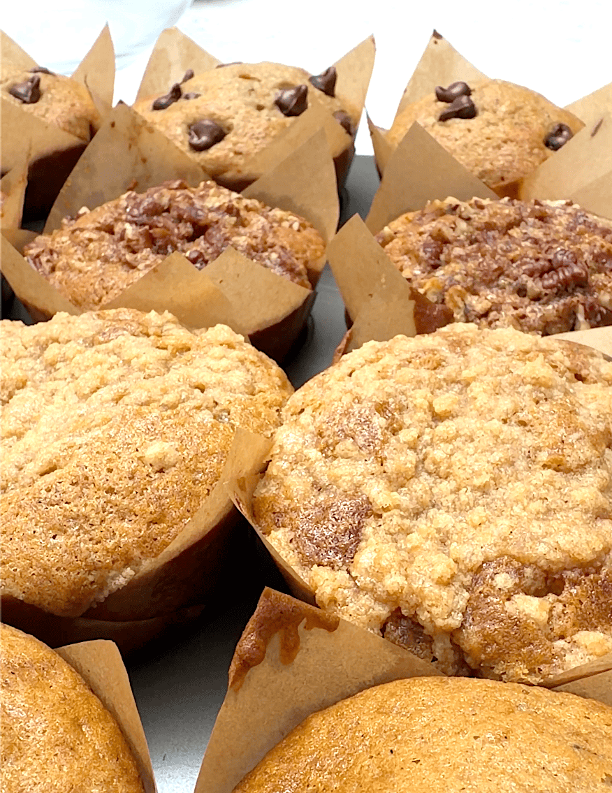 Taking the muffins out of the oven for a tasty snack.