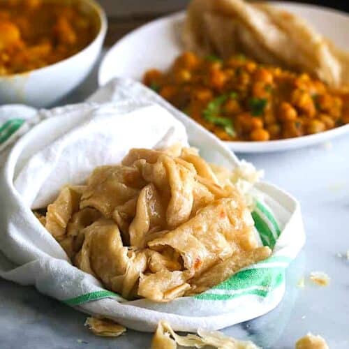 Getting ready to enjoy buss up shut flatbread with curry channa aloo.