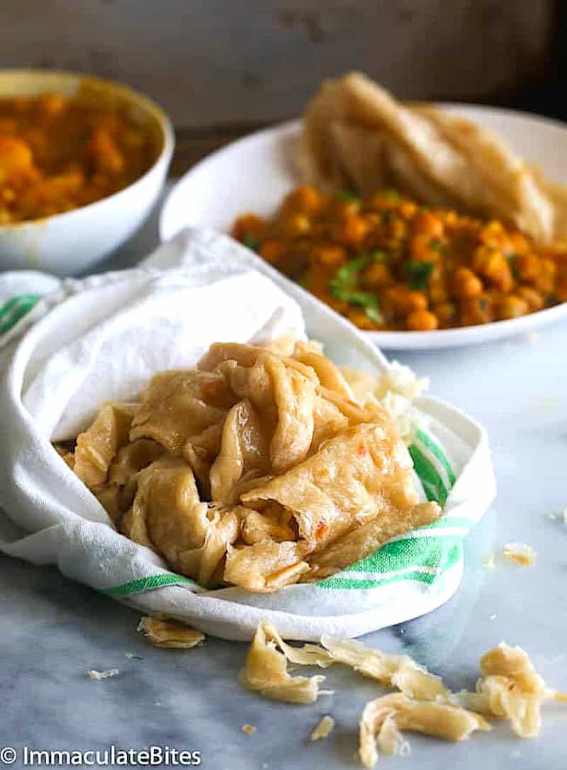 Getting ready to enjoy buss up shut flatbread with curry channa aloo.