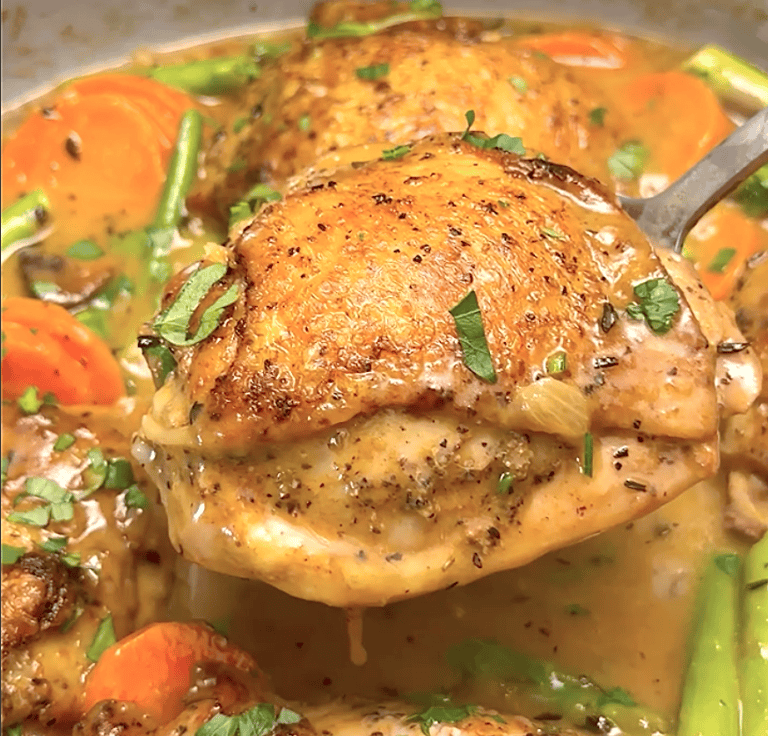 Showing off perfectly tender chicken fricassee made with thighs.
