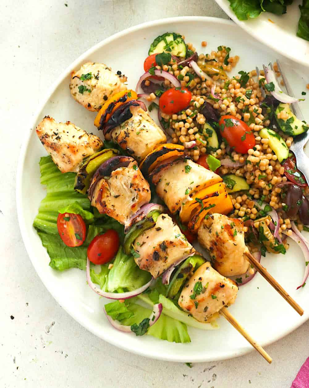 Serving up a plate full of freshly grilled chicken skewers for a healthy and tasty entree.