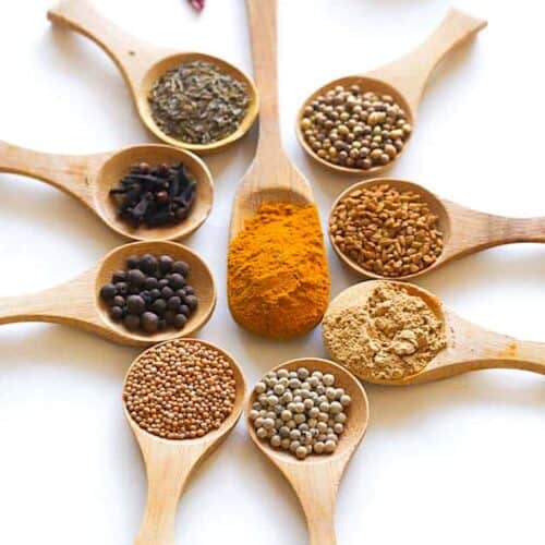 The ingredient list for Jamaican curry powder: turmeric, cumin, coriander, black pepper, ginger, fenugreek, and more.