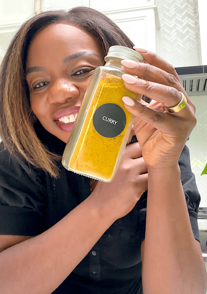 Imma proudly holding up a jar of homemade curry powder.