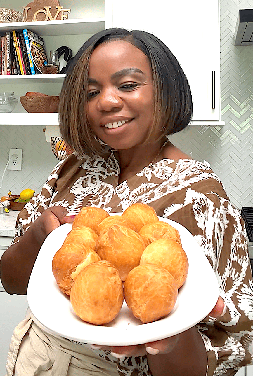 Imma holding up a plate of freshly fried Jamaican dumplings for pure happiness.