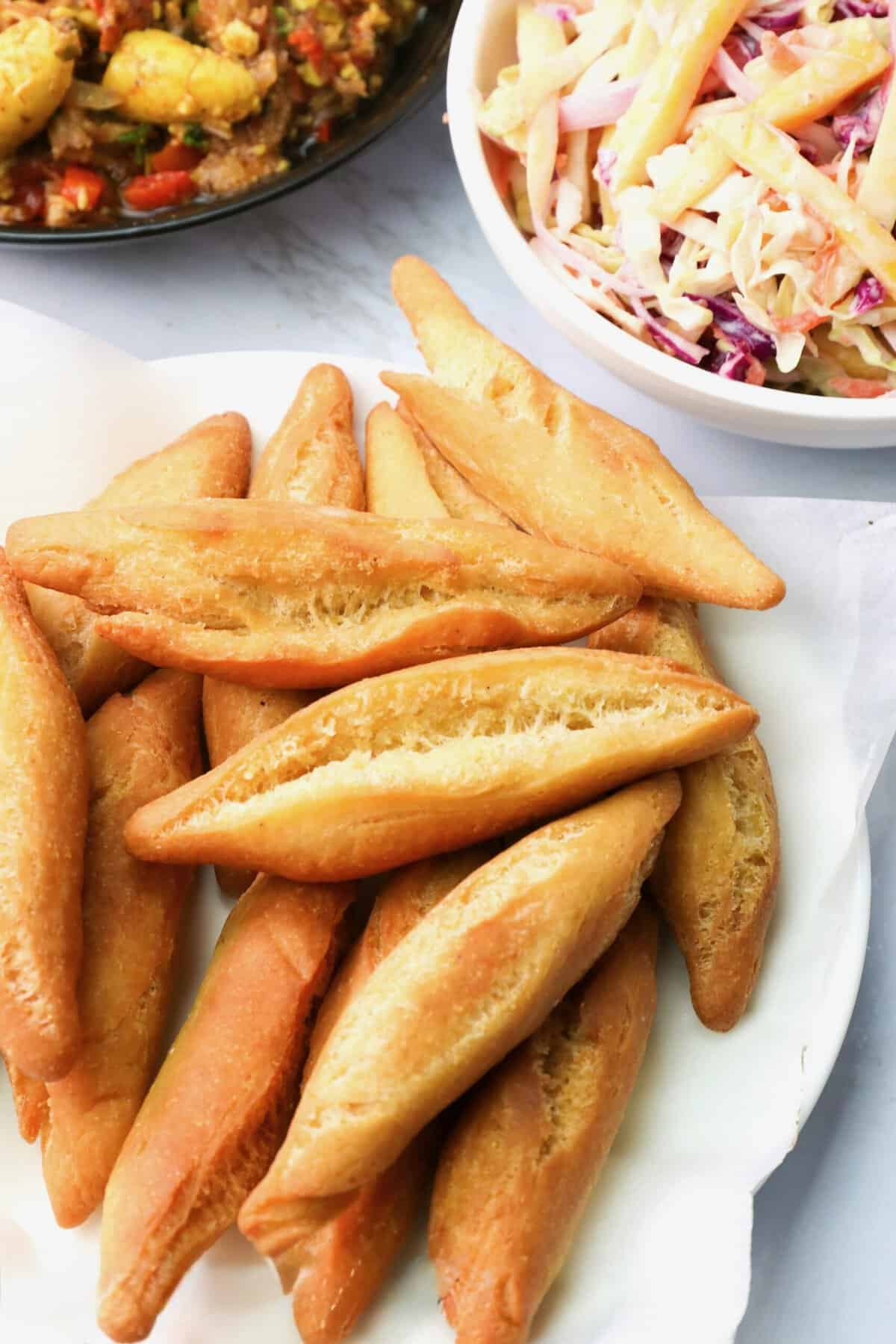 Jamaican festivals, sweeter and denser than a regular fried dumpling.