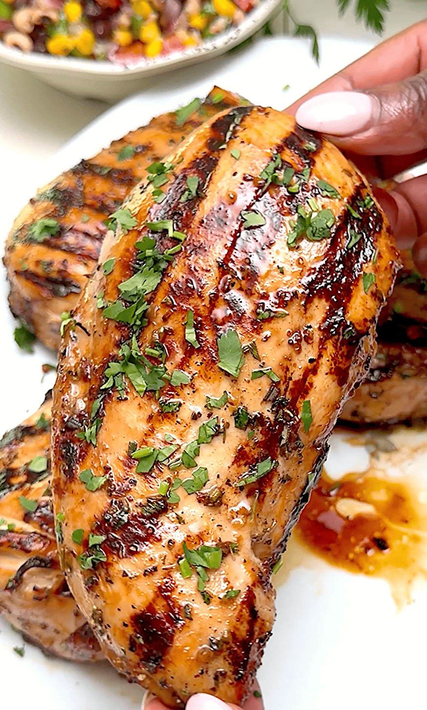 Serving up tender, juicy marinated grilled chicken breasts for a healthy dinner entree.