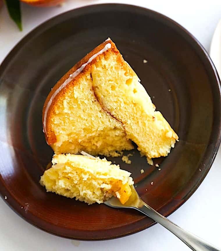 Enjoying a slice of pound cake layered with peach cobbler filling.