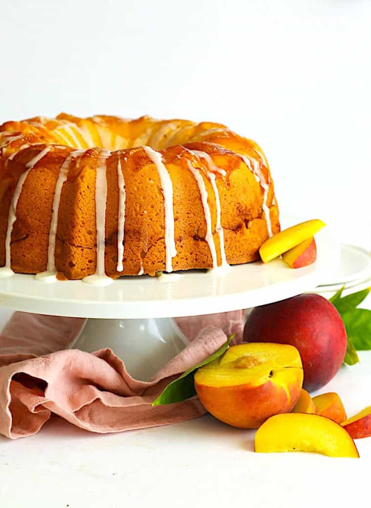 A baked and glazed peach cobbler upside down cake.