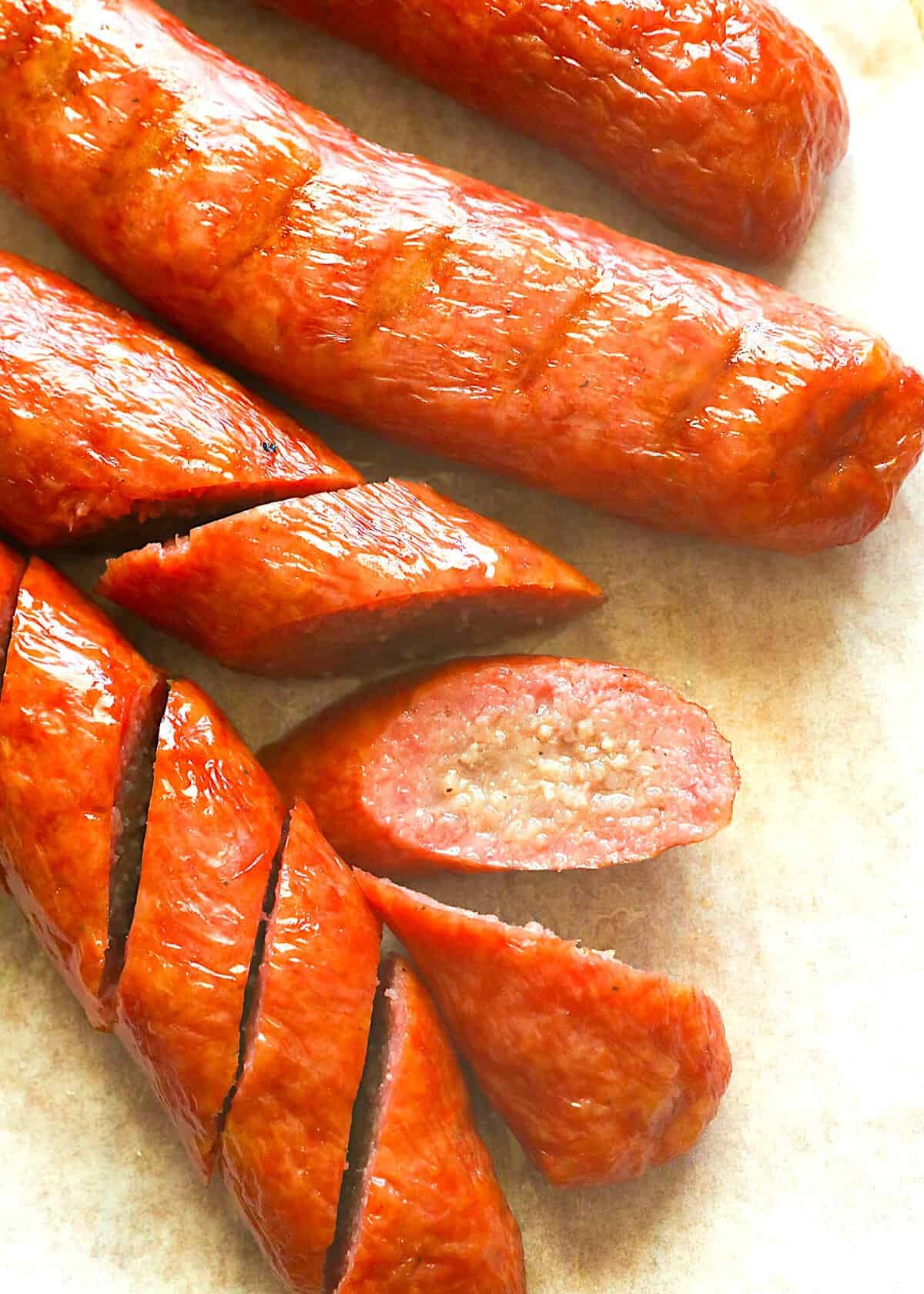 Slicing into freshly smoked sausage for an incredible versatile main course or weekly meal prep ingredient.