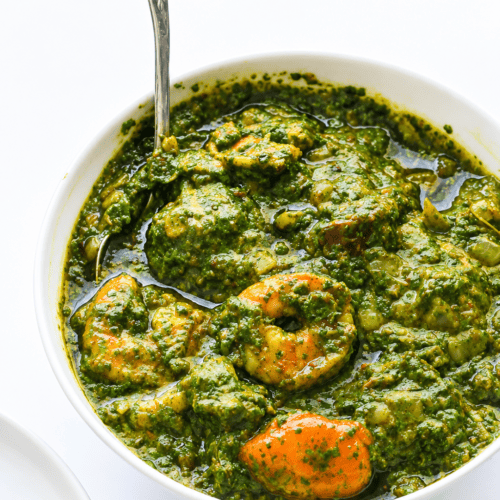 Spooning up freshly made and comforting cassava leaf soup.