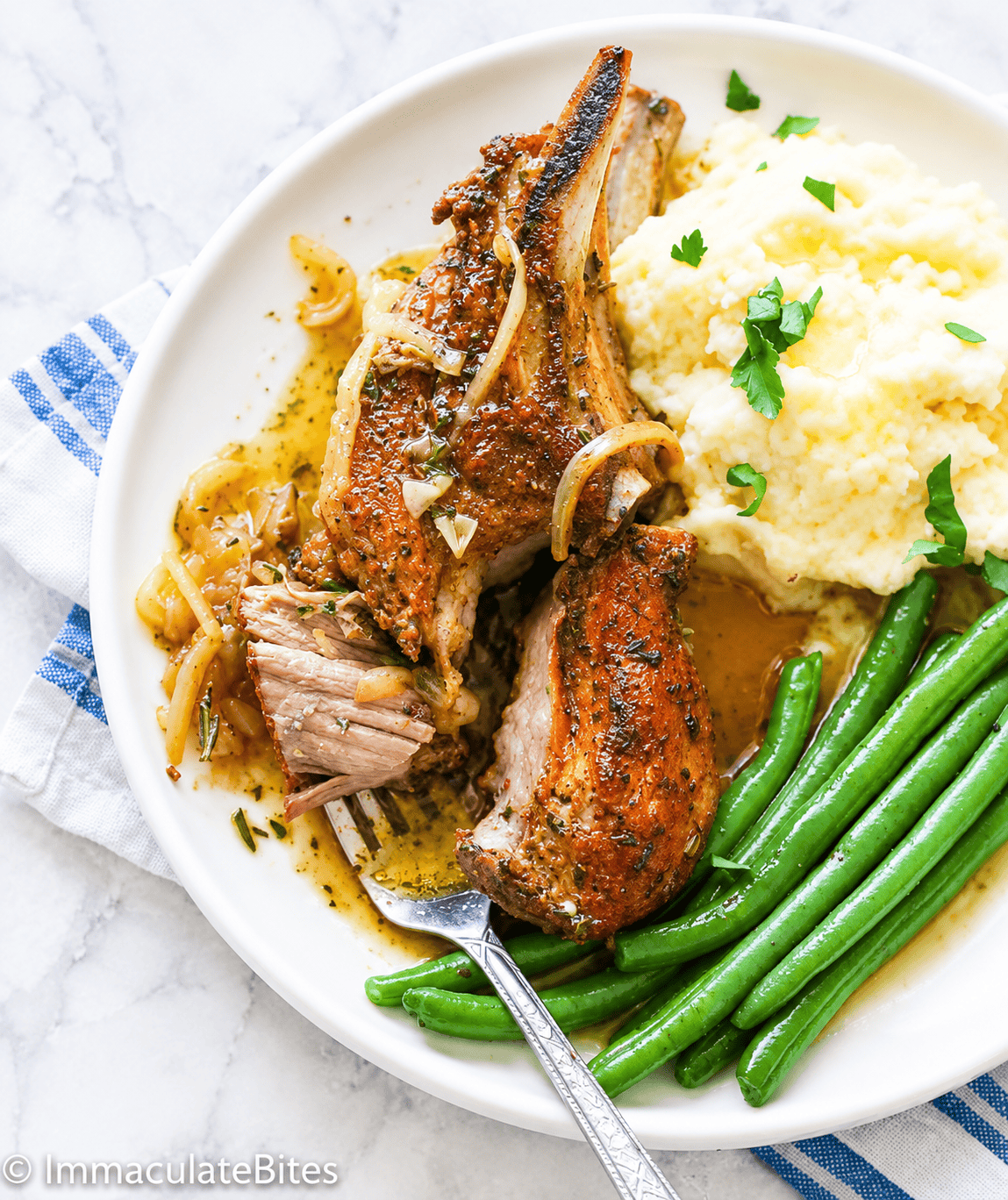 Enjoying country style ribs with gravy, mashed potatoes, and spicy green beans.