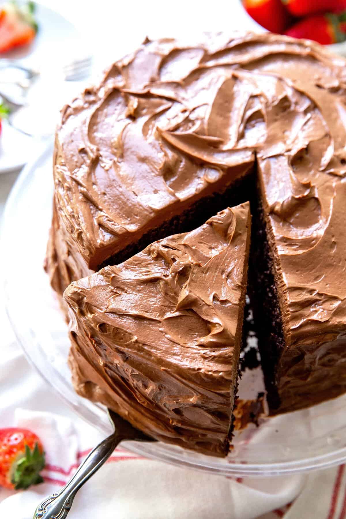 Slicing into a freshly frosted devil's food cake to celebrate life.