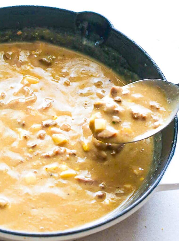 Spooning up perfectly seasoned, creamy giblet gravy perfect for the holiday turkey.