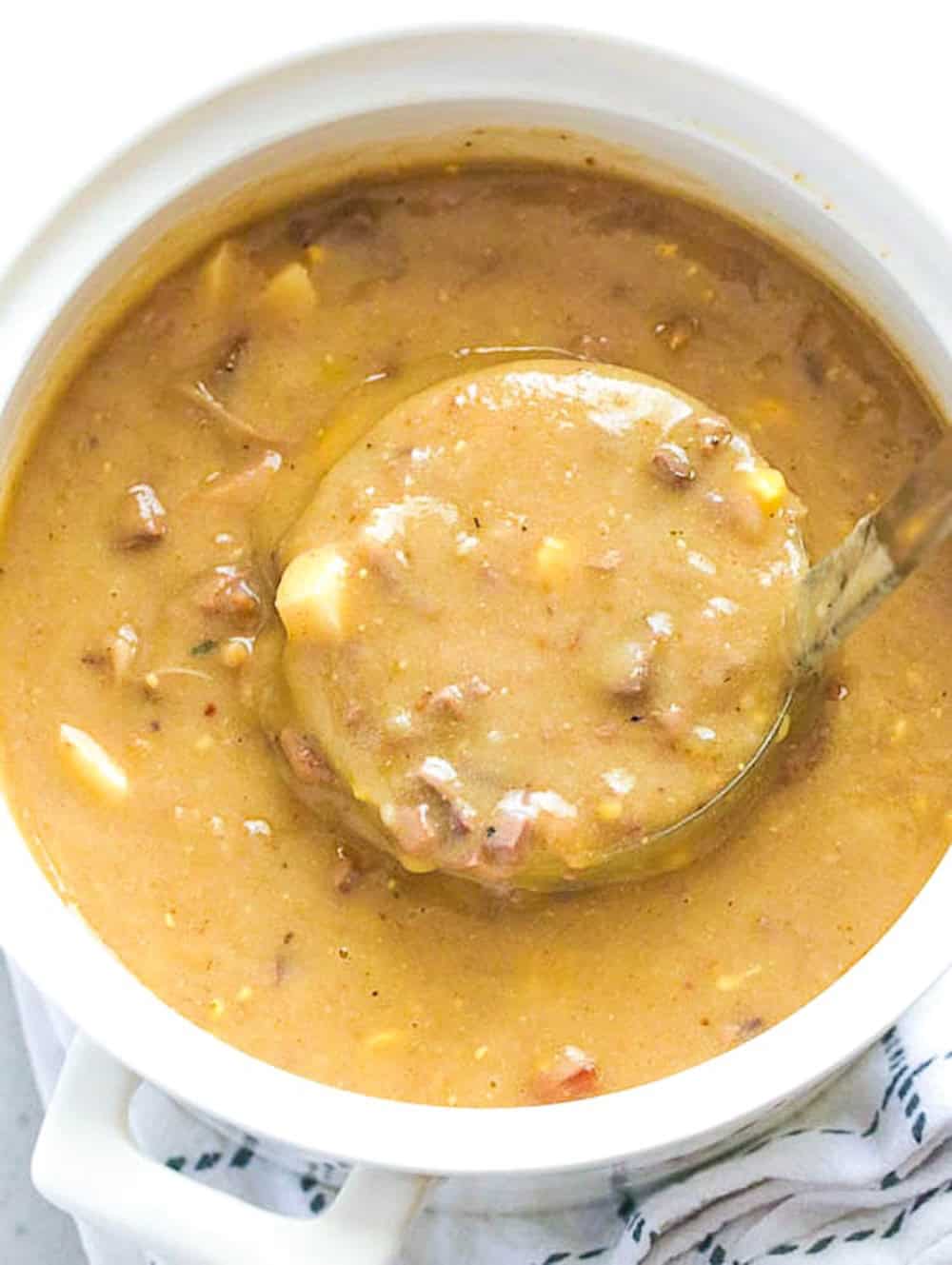 Ladling up savory, flavorful, comfort good giblet gravy perfect over mashed potatoes.