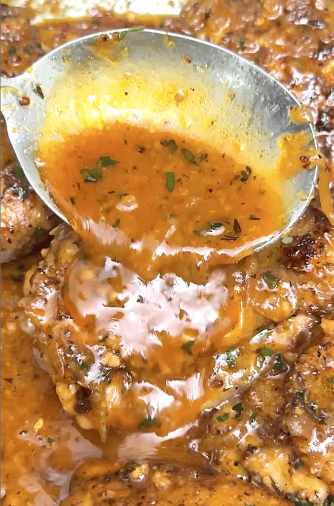 Drizzling the flavorful sauce over chicken thighs for easy weeknight honey mustard chicken.