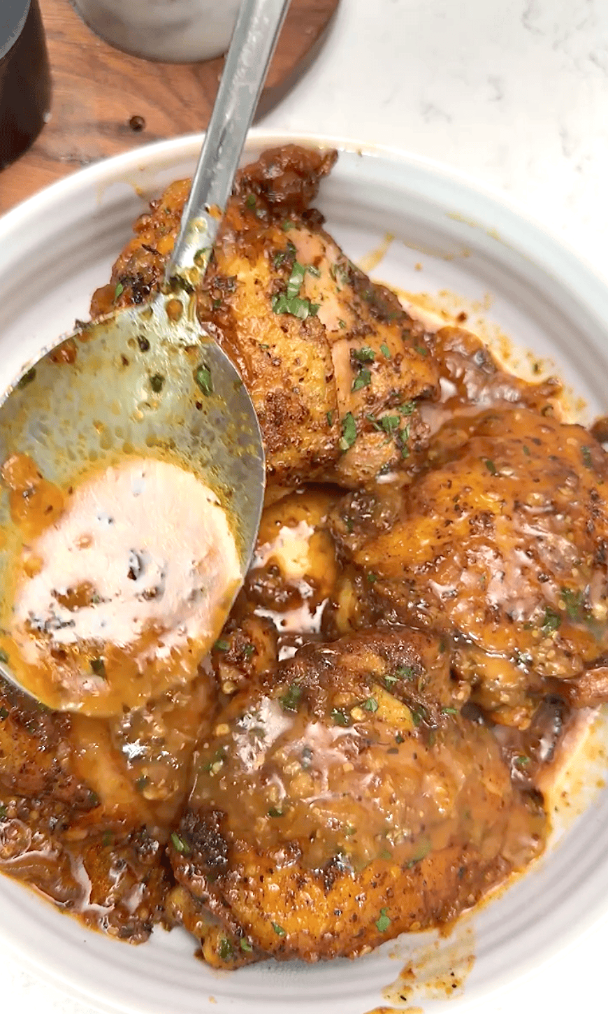 Spooning up chicken in a finger-licking good honey mustard sauce.