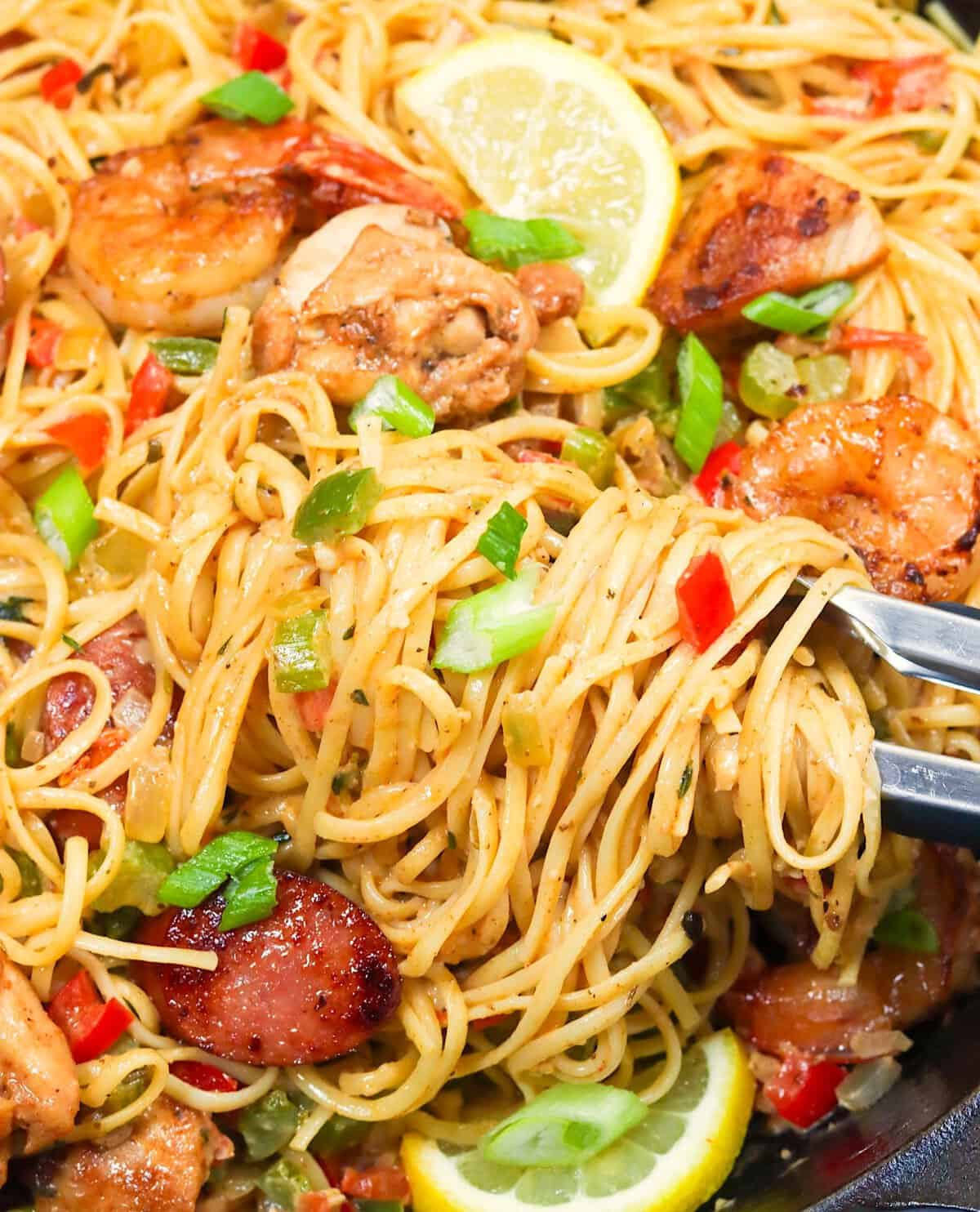 Diving into a freshly made one-pot meal with jambalaya flavors over pasta instead of rice.