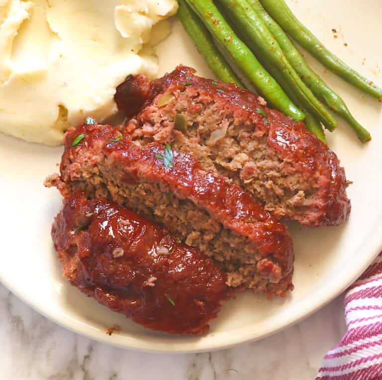 Glazed, smoked meatloaf with mashed potatoes and green beans for an elevated comfort food.