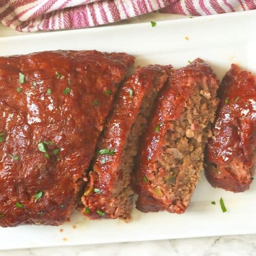 Slicing into a freshly smoked meatloaf for a satisfying comfort food meal.